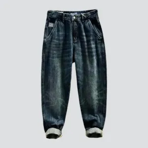 Whiskered dark-wash jeans
 for men